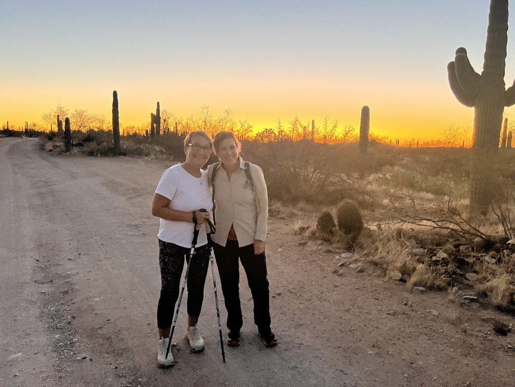 Hiking Arizona trail with sunset background